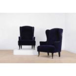 A pair of upholstered wing-back chairs,