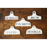 A group of five ceramic wine bin labels,