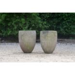 A pair of buff terracotta garden pots,