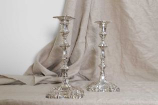 A pair of George II cast silver candlesticks,