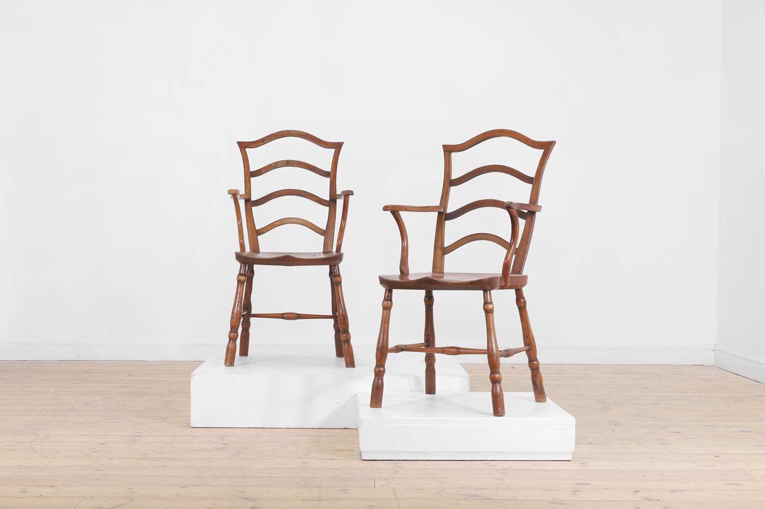 A set of seven vernacular elm and fruitwood chairs,