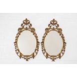 A pair of George III-style giltwood mirrors,