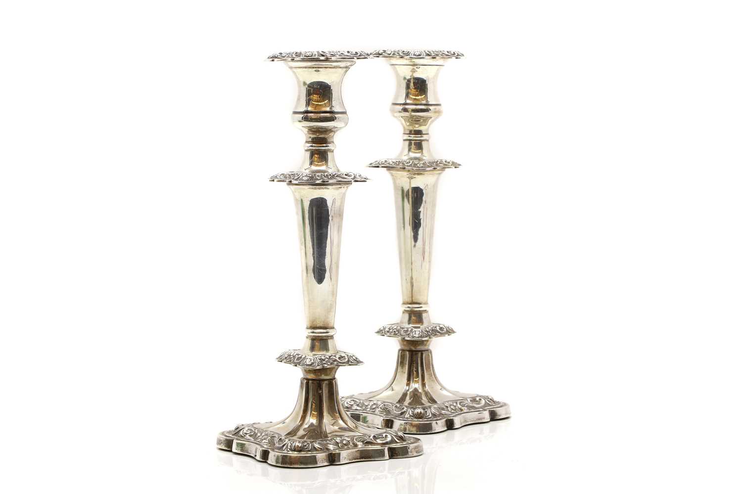 A pair of silver candlesticks,