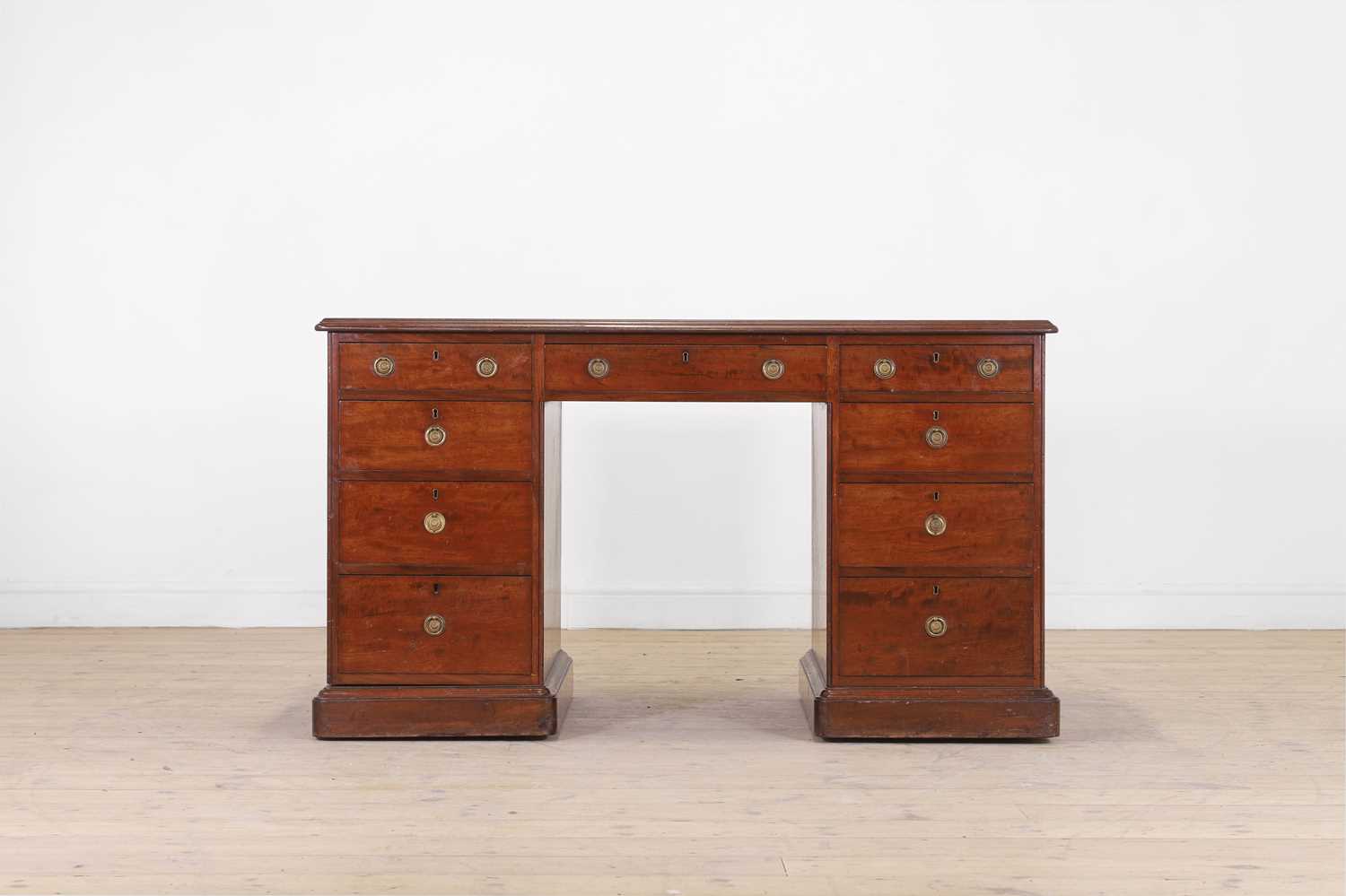 A fiddleback mahogany pedestal desk by Gillows,