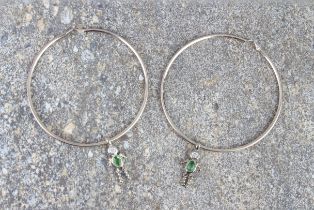 A pair of large silver hoop earrings - stamped '925', each with a detachable figural pendant drop