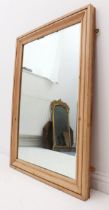 A waxed pine rectangular mirror - with ogee moulded frame and bevelled plate, 105.5 x 74.5 cm.