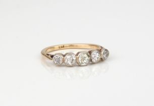 An 18ct gold Victorian five stone, old-cut diamond ring - with five graduated cushion and round