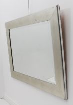 A silver-framed mirror - 'Tuscany Silver' by Gallery Framing of Kent, rectangular with bevelled