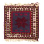A woollen prayer mat from Jerusalem, circa 1939-45 - 40 x 39cm.