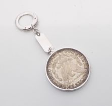 A US American silver $1 One Dollar coin, 1921 - with a keyring mount, stamped 'Sterling', in