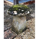 A Cotswold staddle stone - with well weathered and moss covered top, 61cm. diameter, 73cm. high.