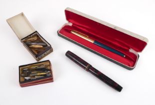 A cased Parker 65 fountain pen in teal blue with striped rolled gold cap and 14k nib; together