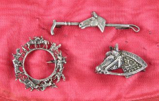 Three vintage silver horse riding / racing related brooches - comprising a circular target brooch,