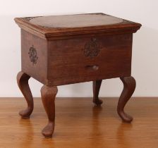 An Eastern hardwood sewing box - mid-20th century, the rectangular lid carved with foliate