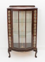 A 1950s walnut display cabinet - the break bowfronted top with short upstand to rear, over a three