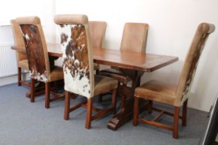 A fine teak refectory-style dining table and six chairs - the richly coloured, cleated, five-plank