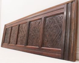 A carved oak panelled double bed head or footboard - early 20th century, the five panels carved with