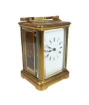 A gilt-brass carriage clock, early 20th century - single train movement, white Roman enamel dial,