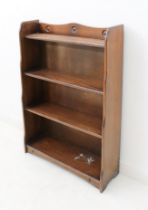 A small Ercol-style stained beech open waterfall bookcase - 1950s-60s, the serpentine back over