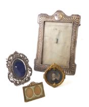 A George V silver photo frame - E. Mander & Son, Birmingham 1913, eared rectangular form with