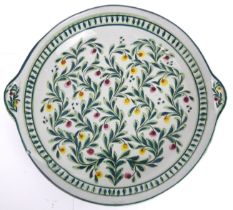 A large Portuguese two-handled glazed terracotta salad bowl - painted with scrolling flowers and