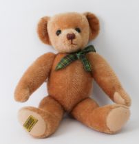 A Merrythought teddy bear in good condition (40 cm high).