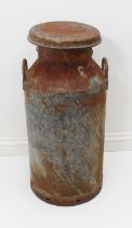 A galvanised milk churn - converted to a post / mail box, the top lifting to reveal a half-height
