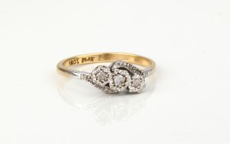 A vintage 18ct gold, platinum and diamond crossover style ring - stamped '18CT PLAT', with three