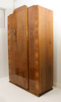 An Art Deco walnut cloud-style three-piece bedroom furniture suite - comprising double and single