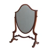 An Edwardian mahogany shield shaped toilet mirror - in the George III style. (WH 37.5 x 52cm.)