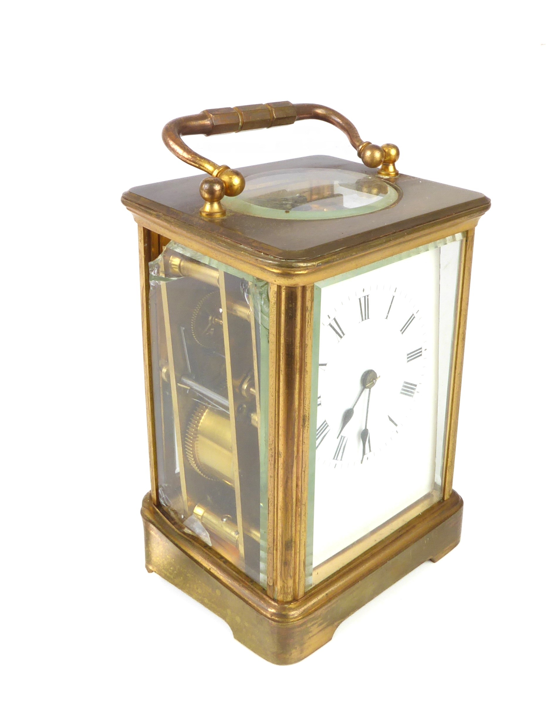 A large brass and bevelled glass carriage clock, marked R&G (18 cm high (handle up). Condition - - Image 2 of 6