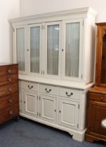 A painted pine glazed dresser or library bookcase - painted off-white, the flared dentil cornice