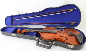 A cased violin (full size) with two bows: pasted typed maker's label to the soundboard - 'Made by