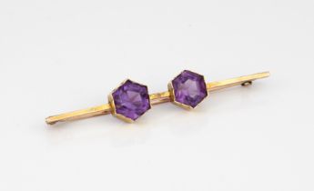 A Victorian 9ct gold amethyst bar brooch - very worn mark to pin, tests as 9ct gold, the two