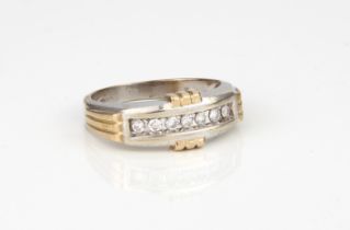A 9ct two-colour gold and diamond seven stone ring set - Birmingham hallmark, the seven brilliant