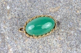 A 9ct gold and aventurine pendant brooch - the oval, cabochon aventurine within a rope twist border,
