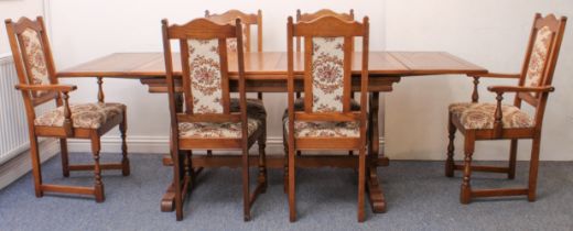 An oak extending dining table and six chairs by Old Charm - the rectangular table with pull-out