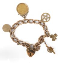 A 9ct gold charm bracelet with four 9ct charms, a mounted 1895 half sovereign and an unmarked cannon