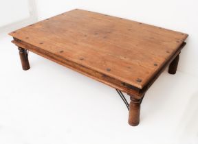A large Eastern hardwood coffee table - late 20th century, the boarded top with clout-head nailed