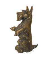 A brass Scottie fireside companion set, stamped 'Redo No. 823456' and 'Made in England'