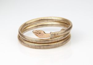 A vintage rolled gold snake bracelet - the flexible coiled bracelet stamped 'Rolled Gold Germany'.