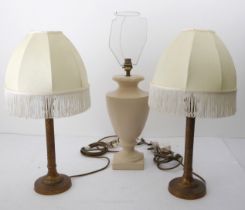 A pair of brass candlestick style table lamps - with spiral reeded columns and bases, with