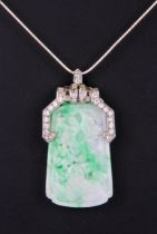 An Art Deco style platinum, jade and diamond pendant - the axe head shaped apple green and white