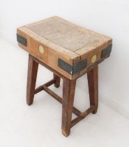 A small mid-century beech and pine butcher's block - the deep, iron-bound top raised on a plain pine
