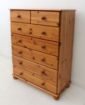 A pine seven-drawer chest (2 over 5) - the moulded top over two short and five long graduated