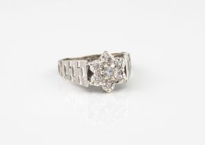 A vintage 9ct white gold and diamond cluster ring - hallmarked Sheffield 1978, the central brilliant