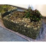 A composite stone garden trough - well weathered, with rock feature and planted with alpines. (LWH