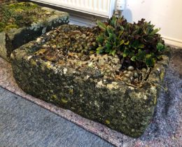 A composite stone garden trough - well weathered, with rock feature and planted with alpines. (LWH