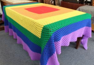 A multicoloured hand crocheted blanket or throw (230 x 208 cm.).