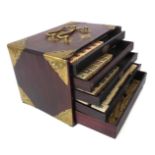 A Chinese bone and bamboo Mah Jong set in a mother-of-pearl inlaid and brass bound hardwood box -